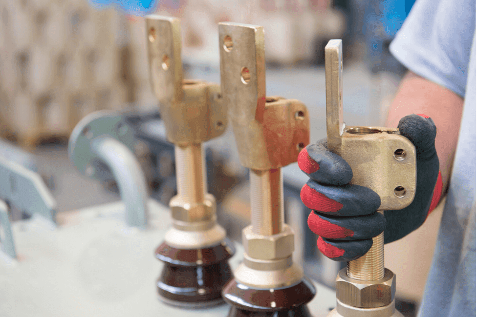 Technician working on transformer bushings and terminals